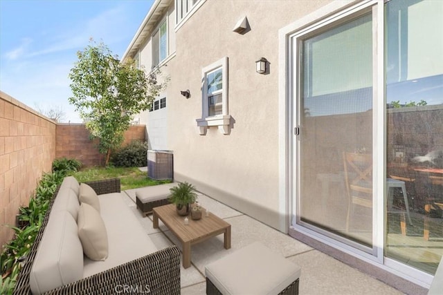 view of patio / terrace featuring an outdoor hangout area, central AC, and a fenced backyard