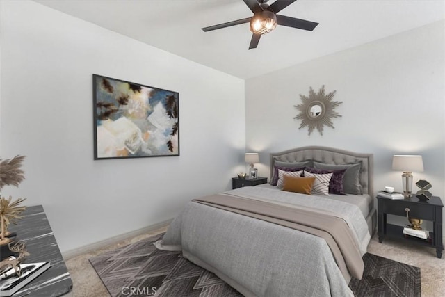 bedroom with carpet, ceiling fan, and baseboards