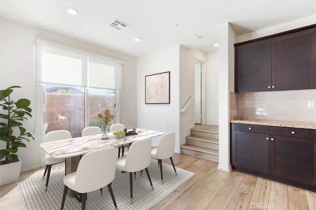 dining area with stairs, recessed lighting, visible vents, and light wood-style floors