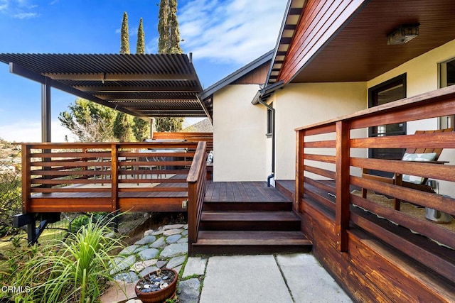 wooden deck featuring a pergola