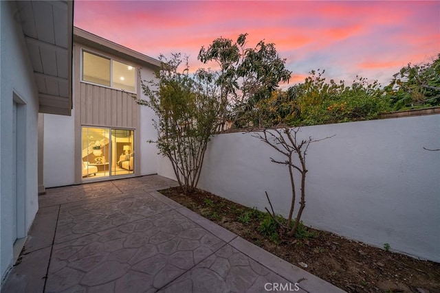 patio terrace at dusk with fence