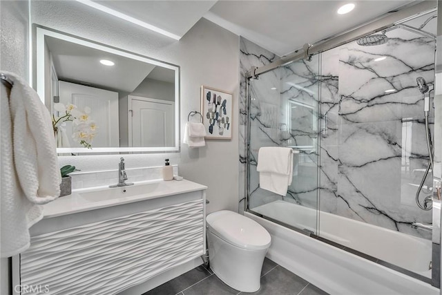 full bath with toilet, recessed lighting, shower / bath combination with glass door, vanity, and tile patterned floors