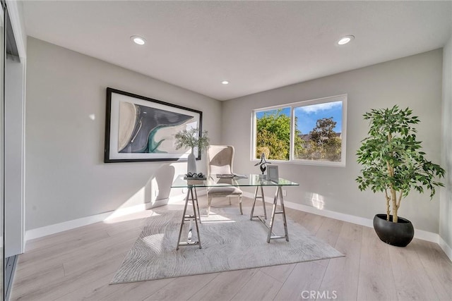 office space featuring recessed lighting, wood finished floors, and baseboards