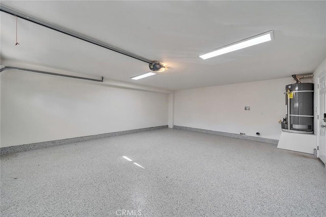 garage with water heater, baseboards, and a garage door opener