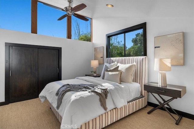 bedroom featuring light carpet and lofted ceiling