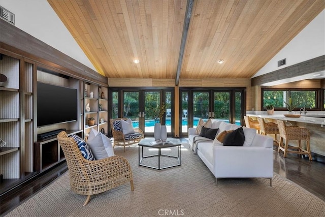 living area featuring vaulted ceiling with beams, french doors, wooden ceiling, and wood finished floors