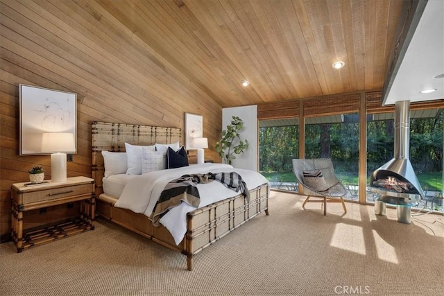 bedroom with wooden ceiling, recessed lighting, light colored carpet, wooden walls, and access to outside