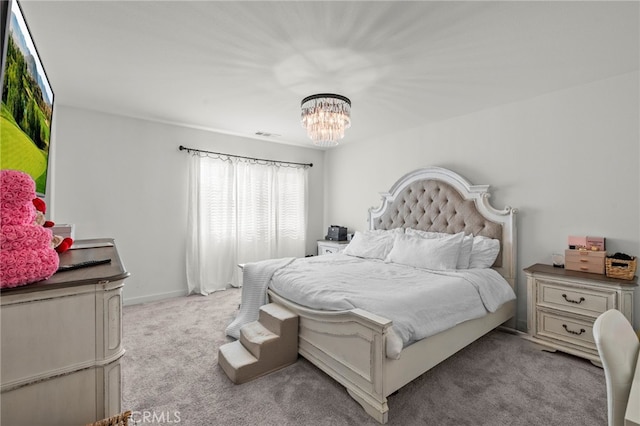 bedroom featuring light colored carpet, visible vents, baseboards, and an inviting chandelier