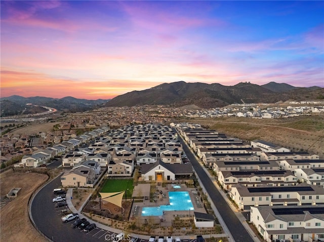 drone / aerial view featuring a mountain view