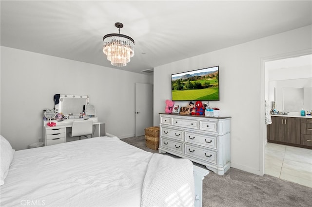 bedroom featuring an inviting chandelier, baseboards, and light colored carpet