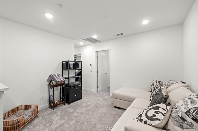 living area featuring recessed lighting, visible vents, baseboards, and light colored carpet