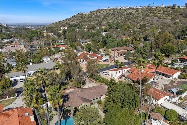 birds eye view of property with a residential view