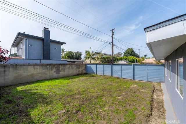 view of yard featuring a fenced backyard