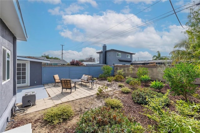 view of patio with a fire pit and a fenced backyard