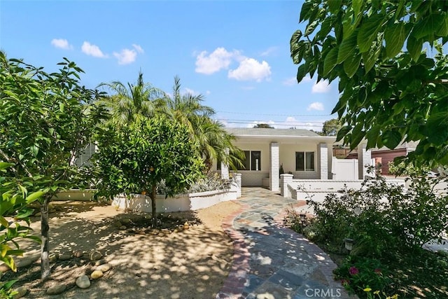 view of front of property featuring fence