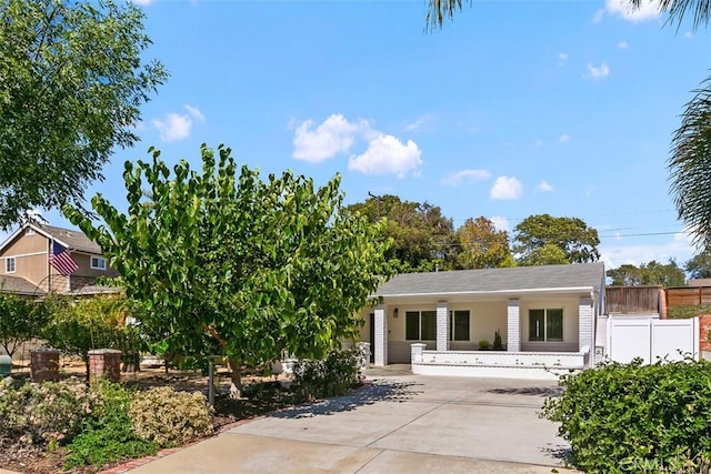 view of front of house featuring fence