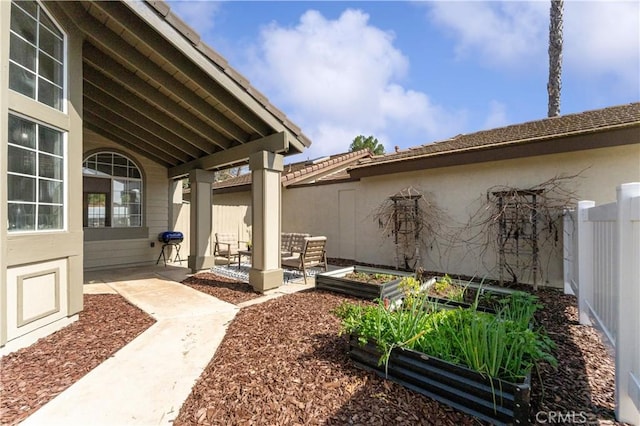 exterior space with fence private yard and a vegetable garden