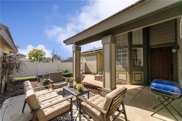 view of patio / terrace featuring a fenced backyard, a grill, and an outdoor hangout area