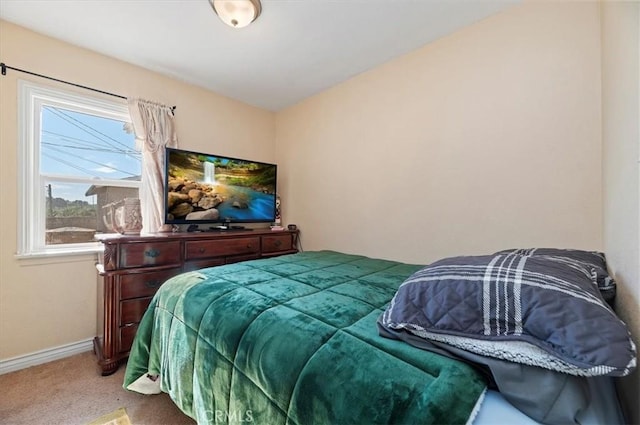 carpeted bedroom with baseboards