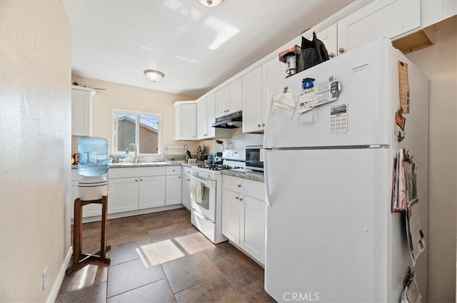 kitchen featuring white appliances, white cabinetry, a sink, and under cabinet range hood