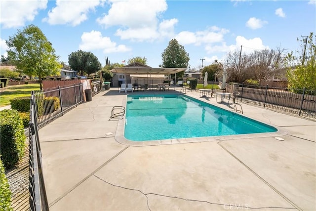 view of pool featuring fence, a patio, and a fenced in pool