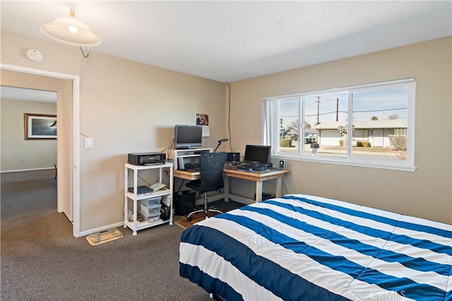 bedroom with carpet flooring and baseboards