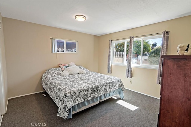 bedroom featuring carpet flooring and baseboards