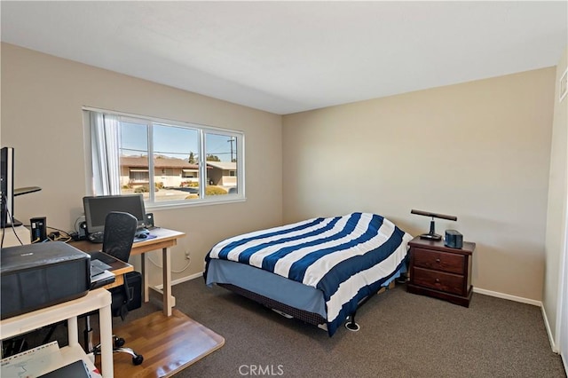 carpeted bedroom with baseboards