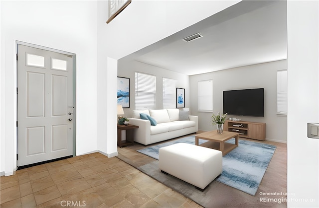 foyer entrance with visible vents and baseboards