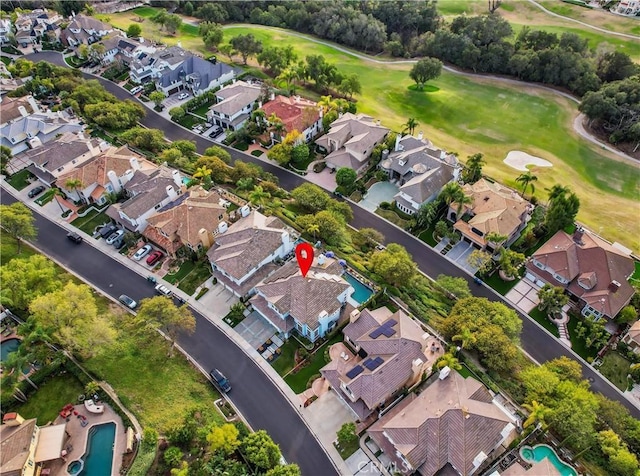 birds eye view of property with a residential view and golf course view