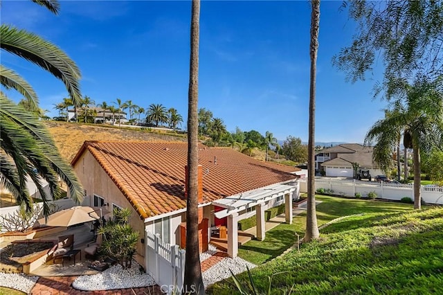 exterior space featuring fence and a yard