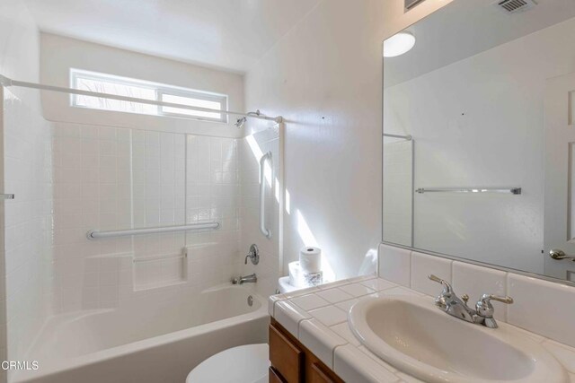 full bathroom featuring toilet, vanity, and shower / bathing tub combination