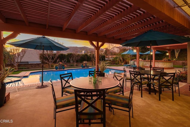 pool featuring a patio area, a mountain view, and a pergola