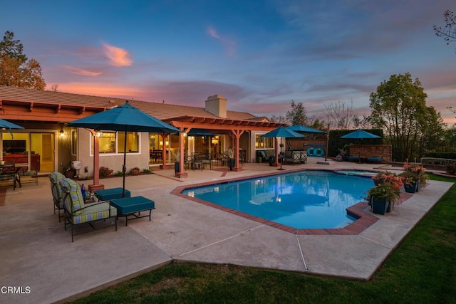 view of pool with a fenced in pool, a patio, and a pergola