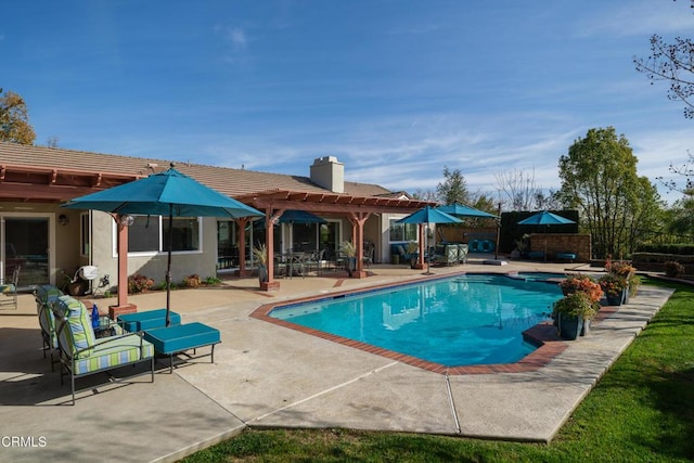 view of pool featuring a patio, a fenced in pool, and a pergola