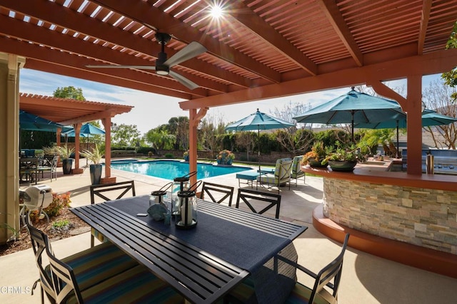 view of patio / terrace with a fenced in pool, outdoor dining area, ceiling fan, and a pergola