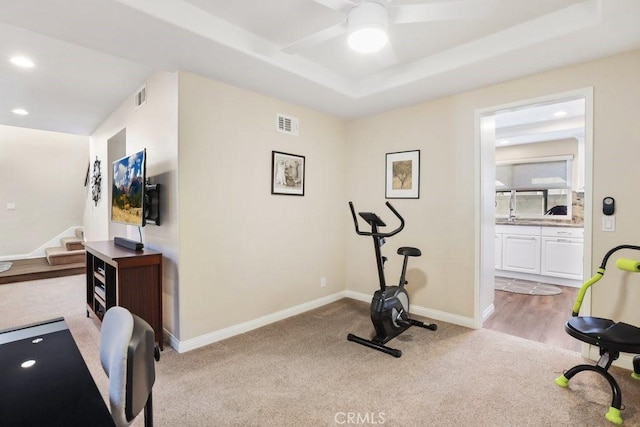 exercise room featuring recessed lighting, visible vents, light carpet, and baseboards