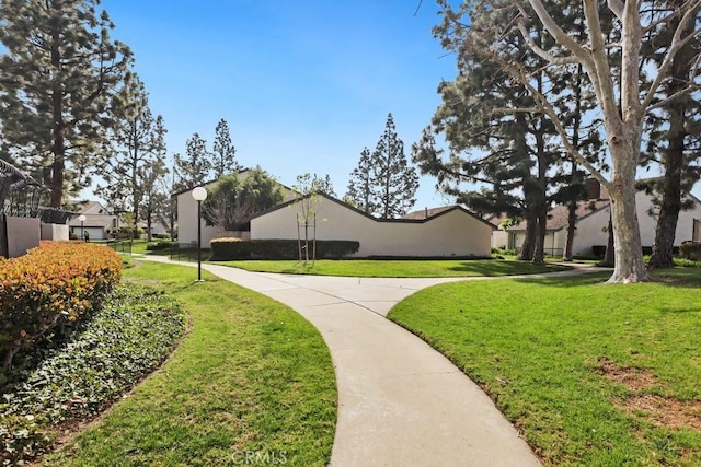 surrounding community with a residential view and a lawn