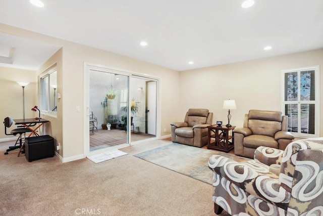 living room with baseboards, recessed lighting, and light colored carpet