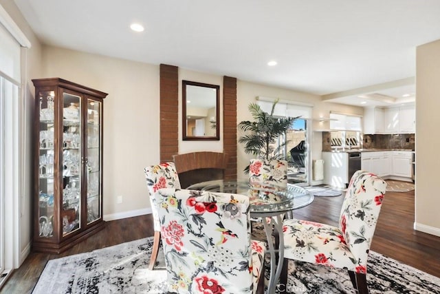 dining space with dark wood-style floors, baseboards, and recessed lighting