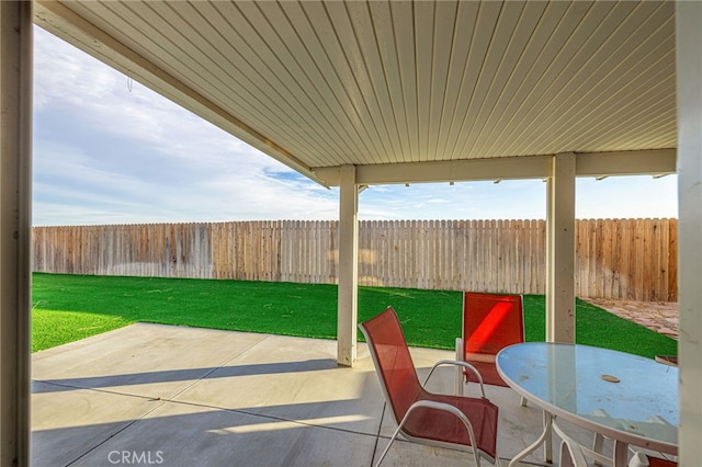 view of patio featuring outdoor dining space and a fenced backyard