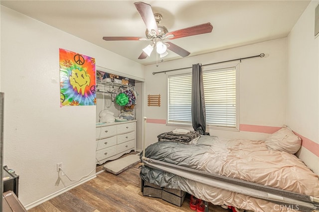 bedroom featuring a ceiling fan and wood finished floors