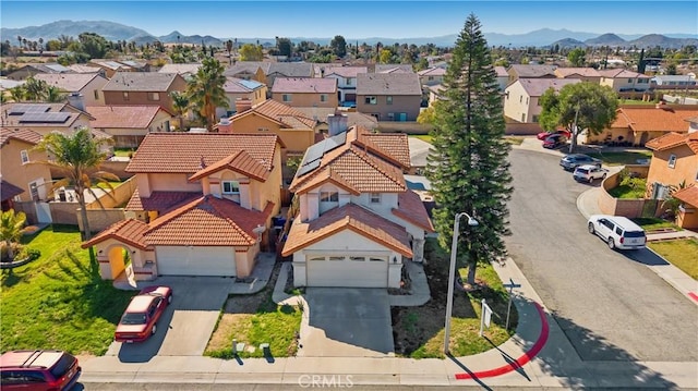 drone / aerial view featuring a mountain view and a residential view