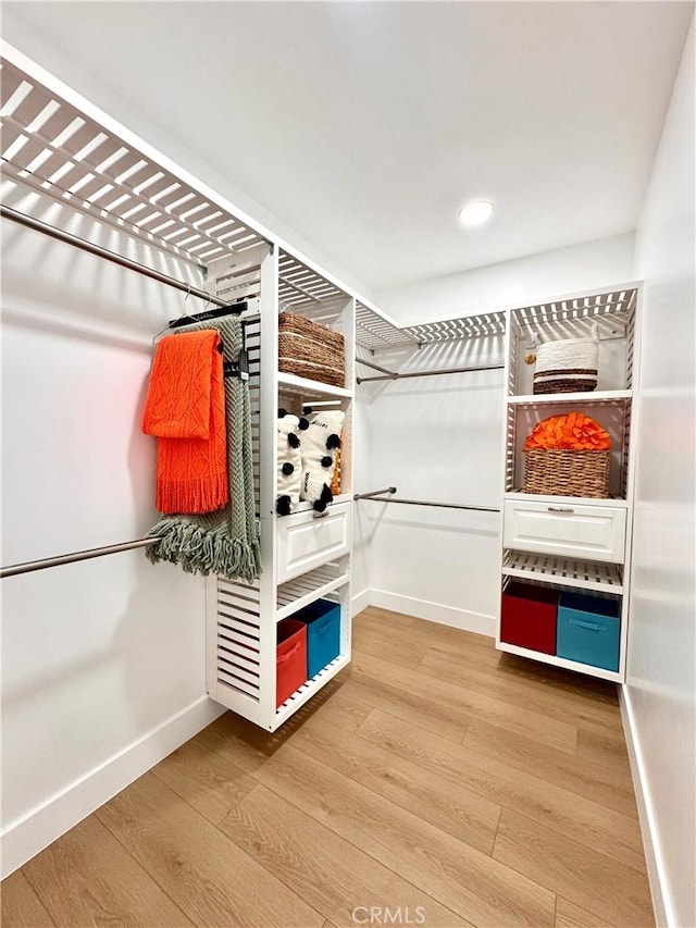 spacious closet with wood finished floors