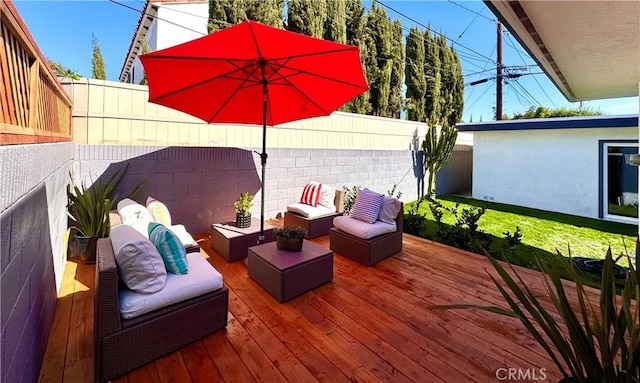 wooden terrace with fence and an outdoor living space