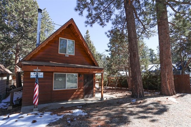 view of front of house featuring fence