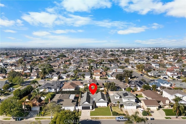 birds eye view of property with a residential view