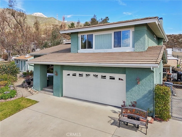 5020 Solitude Ct, Rancho Cucamonga, CA 91737 - view of front facade featuring concrete driveway, a tile roof, and stucco siding