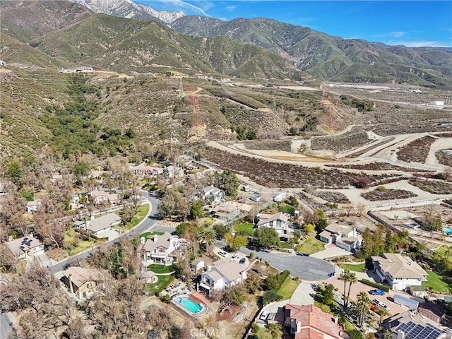 5020 Solitude Ct, Rancho Cucamonga, CA 91737 - aerial overview of property's location featuring a mountainous background and nearby suburban area
