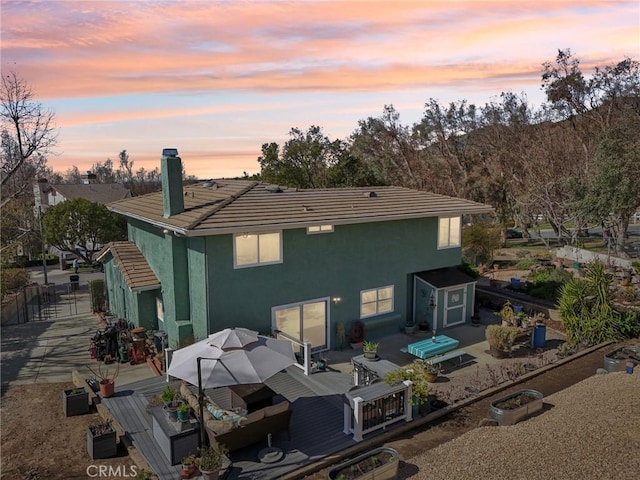 5020 Solitude Ct, Rancho Cucamonga, CA 91737 - back of house with a chimney, stucco siding, outdoor lounge area, a tile roof, and a patio area